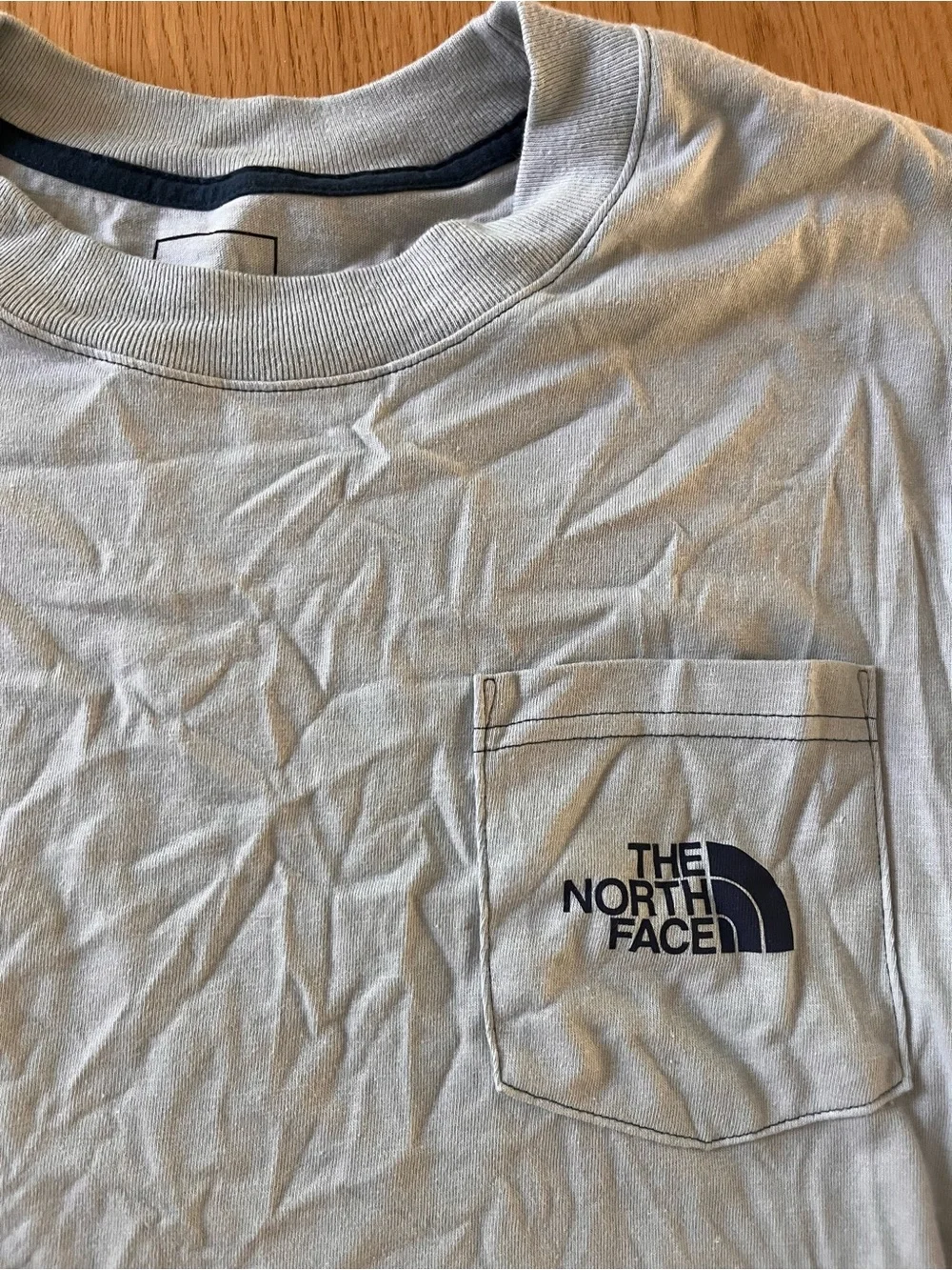 The North Face Men’s Long-Sleeve Pocket Tee with Carabiner graphic- Light Blue